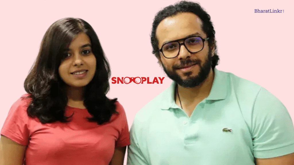 Snooplay co-founders Aanchal Mahajan and Brij Raj Singh standing together in front of the company logo.